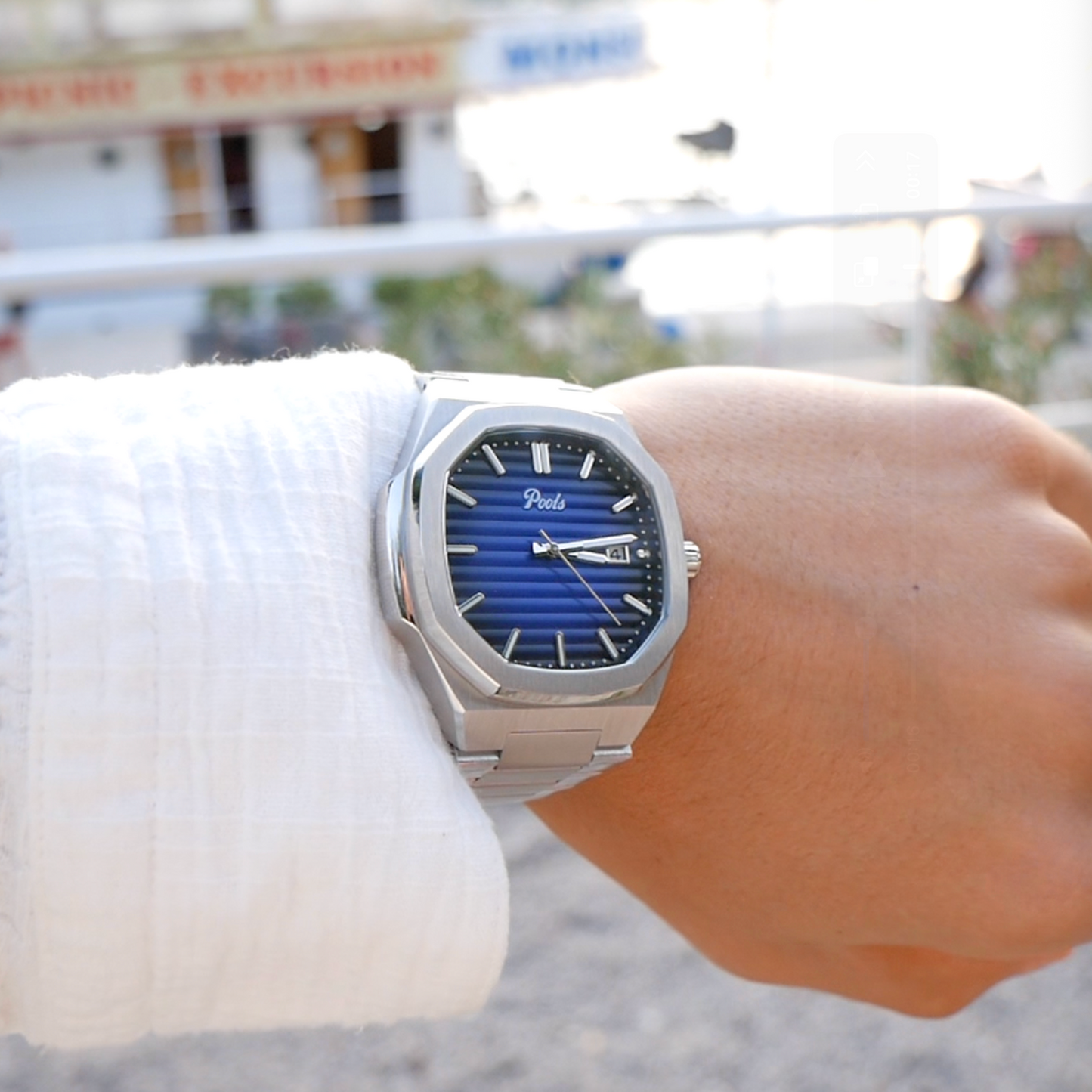 Pools CISANO Herrenuhr mit dunkelblauen Zifferblatt und Edelstahlarmband Tragebild am Arm